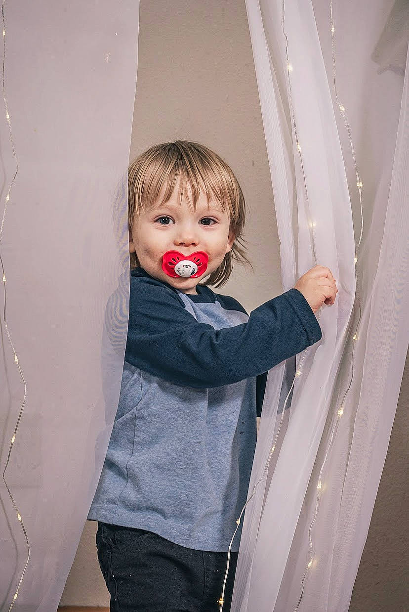 Johnathan joined the competition — help win amazing prizes! ball, child, costume, curtain, design, flash_photography, fun, gesture, happy, interior_design, laugh, person, room, sleeve, smile, standing, t_shirt, textile, toddler, window