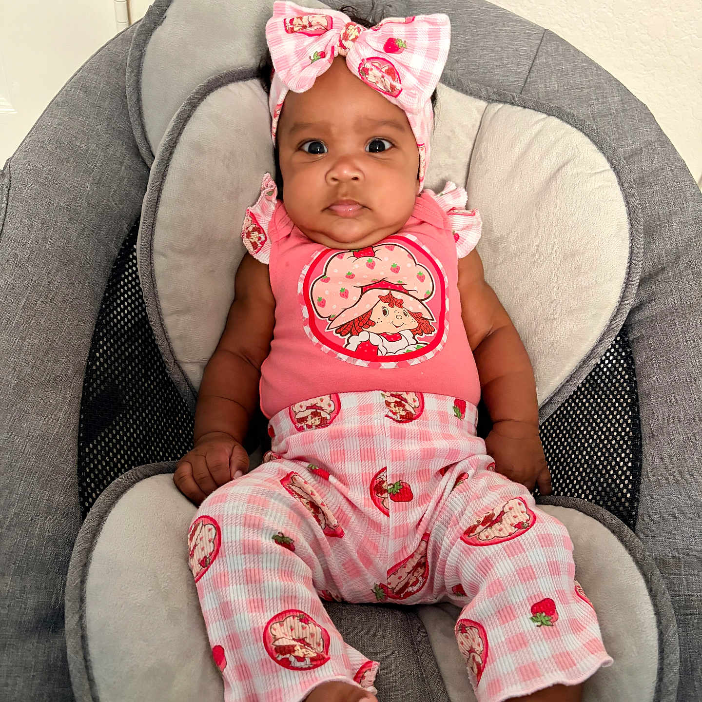 Zyaa joined the competition — help win amazing prizes! baby, infant, child, pink_clothing, headband, strawberry_pattern, baby_chair, cushion, indoor, portrait, cute, comfortable, seated, looking_at_camera, chubby_cheeks, wide_eyes, fabric, soft_texture, adorable, young