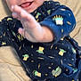 Ayrton a rejoint le concours — aidez-le/la à gagner de superbes lots ! baby, child, infant, smiling, happy, onesie, baby_yoda, blue_clothing, cute, tongue_out, hand, reaching, lying_down, soft_background, indoor, portrait, young_child, apparel, face, person