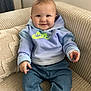 baby, child, smiling, hoodie, nike, jeans, couch, beige, cozy, indoor, cute, infant, sitting, casual_clothing, socks, portrait, happy, face, person, home