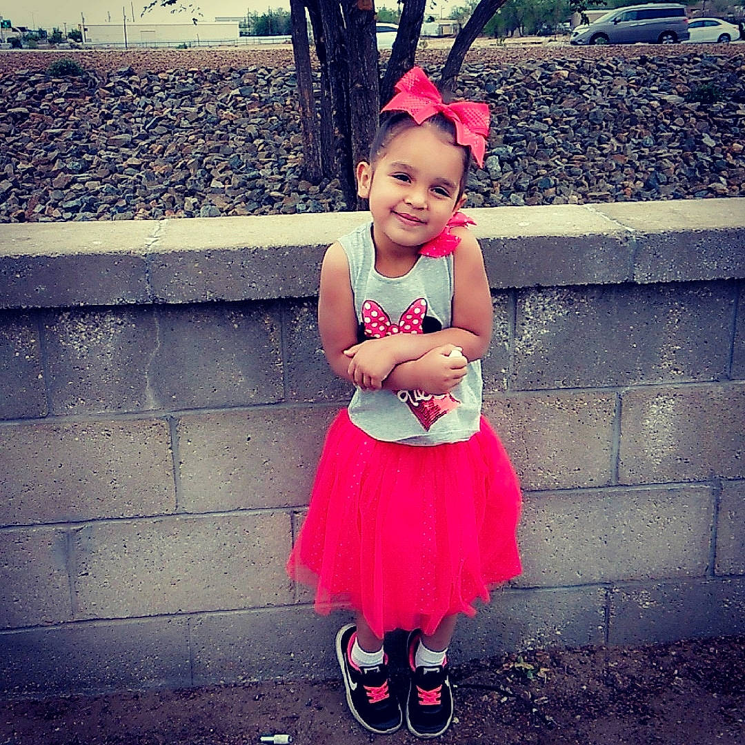 Athena is registered to the contest to win money with this photo: baby_products, baby_toddler_clothing, ballet_tutu, child, child_model, clothing, costume, dress, hair_accessory, happy, joy, person, pink, shoe, smile, toddler