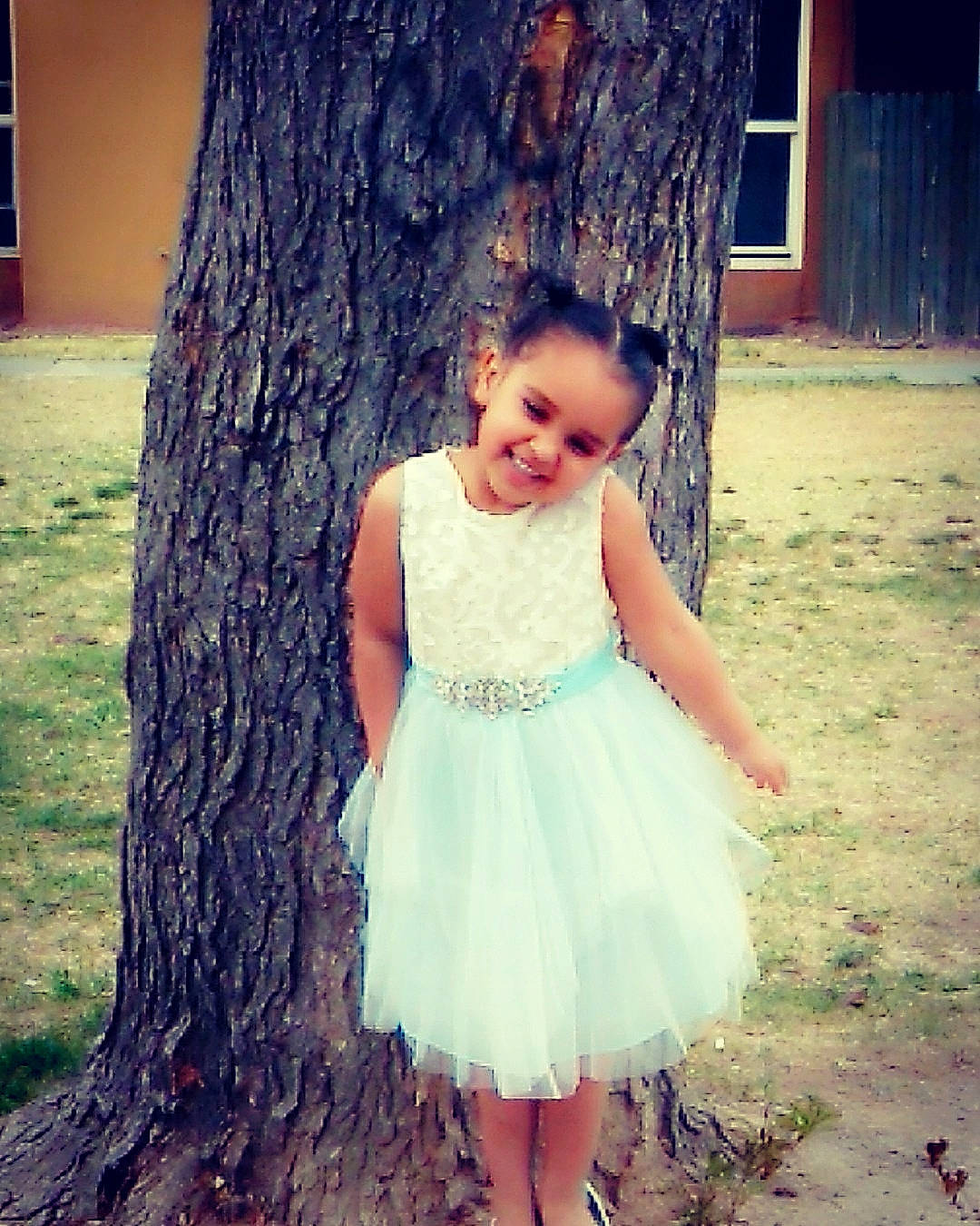 Athena is registered to the contest to win money with this photo: a_line, beauty, child, child_model, clothing, dress, eye, grass, joy, long_hair, person, pink, plant, skin, smile, summer, toddler, tree, trunk, waist