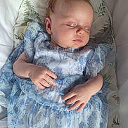 Arielle joined the competition — help win amazing prizes! baby, sleeping, dress, blue, floral, infant, peaceful, cushion, bird, tree, soft, closeup, hand, face, child, adorable, cute, portrait, resting, indoors