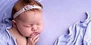 Arielle joined the competition — help win amazing prizes! baby, sleeping, headband, flower, pastel, lavender, blanket, soft, cute, newborn, peaceful, portrait, infant, child, skin, hand, face, rest, cozy, closeup