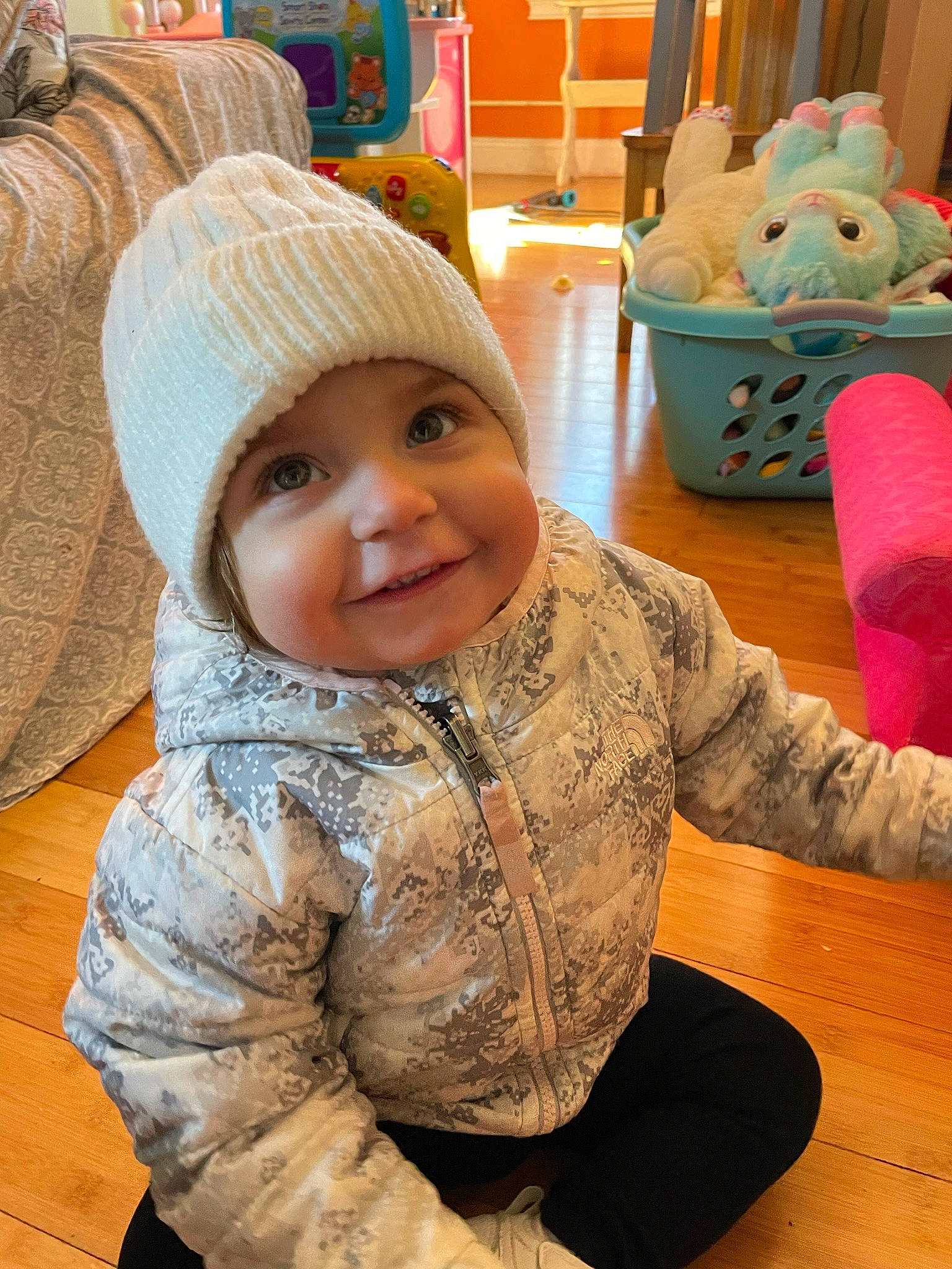 Milah is registered to the contest to win money with this photo: baby, baby_toddler_clothing, cap, cheek, child, comfort, fashion_accessory, flooring, fun, happy, hardwood, headgear, headwear, joy, person, play, room, skin, sleeve, smile