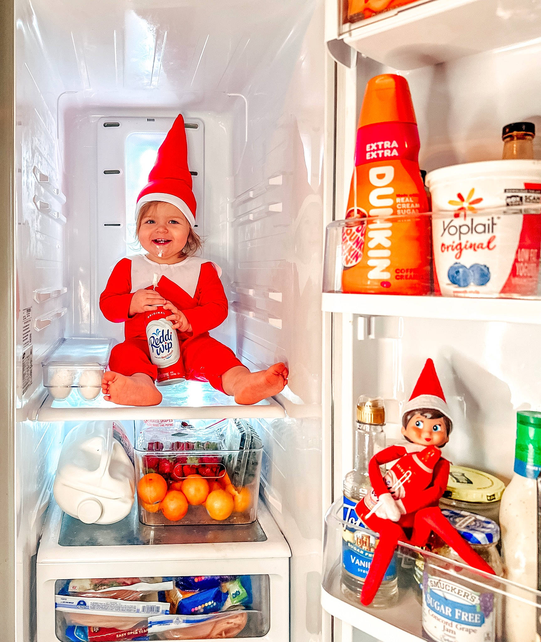 Esme joined the competition — help win amazing prizes! bottle, carbonated_soft_drinks, food_storage_containers, gas, hat, headwear, home_appliance, joy, kitchen_appliance, machine, major_appliance, natural_foods, orange, packaging_and_labeling, person, plastic, plastic_bottle, refrigerator, room, shelf