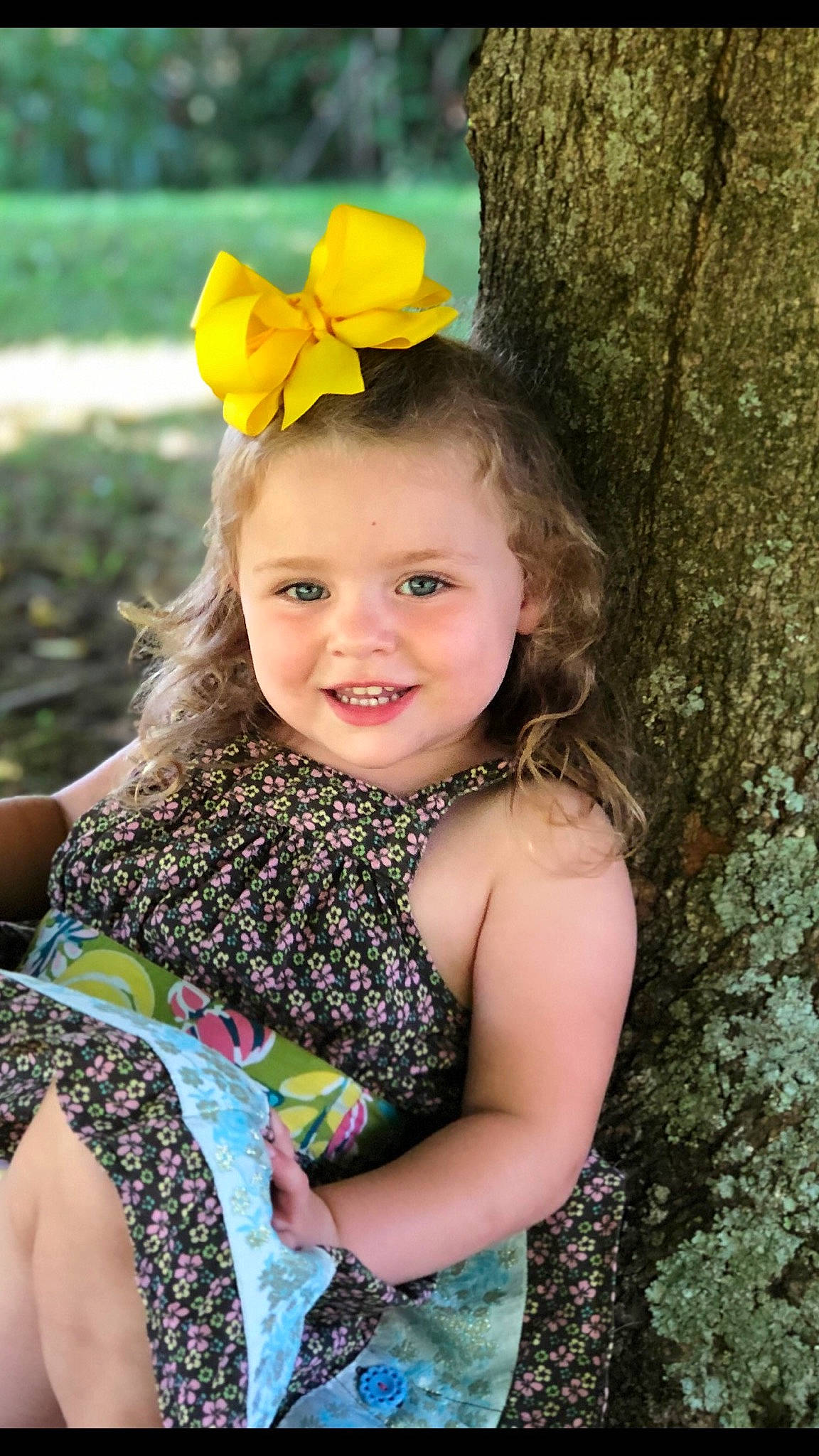 Breanna joined the competition — help win amazing prizes! botany, fawn, flash_photography, flower, grass, happy, iris, joy, leaf, leisure, nature, organ, people_in_nature, person, photograph, skin, smile, summer, sunlight, toddler