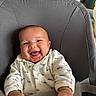 Ayden a rejoint le concours — aidez-le/la à gagner de superbes lots ! baby, smiling, infant, onesie, whale_pattern, baby_seat, indoor, child, happy, cute, portrait, clothing, hands, face, seat_belt, soft_fabric, person, baby_furniture, expression, warm_lighting