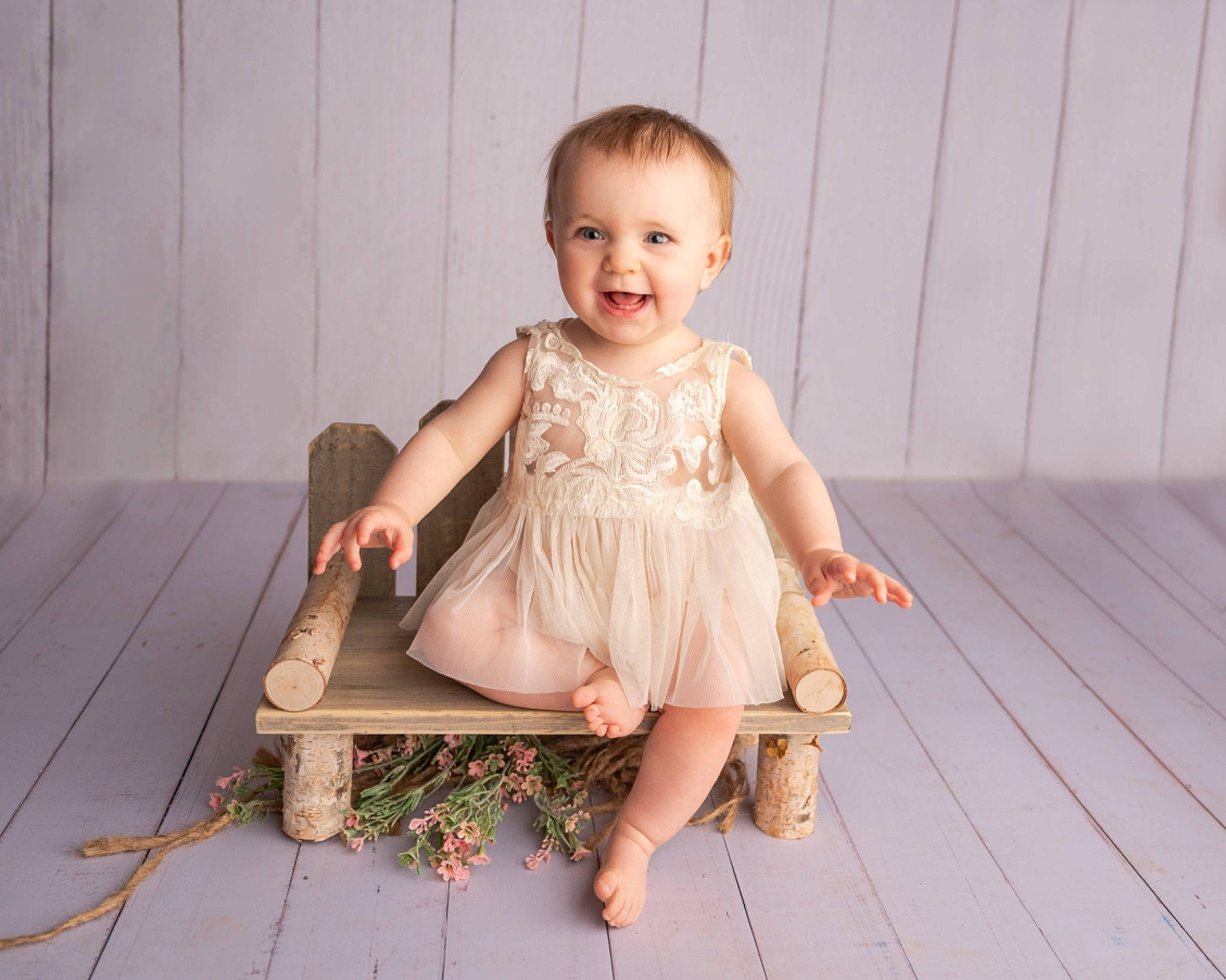Temperance is registered to the contest to win money with this photo: baby, baby_toddler_clothing, day_dress, dress, eye, flash_photography, floor, flooring, foot, fun, grass, happy, hardwood, joy, leg, person, skin, sleeve, smile, toddler
