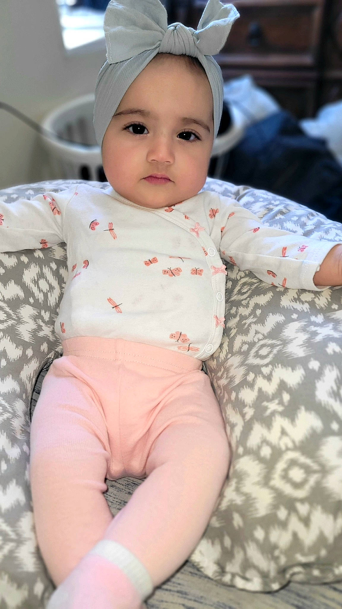 Erika is registered to the contest to win money with this photo: baby, baby_toddler_clothing, cap, cheek, child, chin, comfort, eye, happy, head, headgear, lip, nose, person, pink, skin, sleeve, t_shirt, thigh, toddler