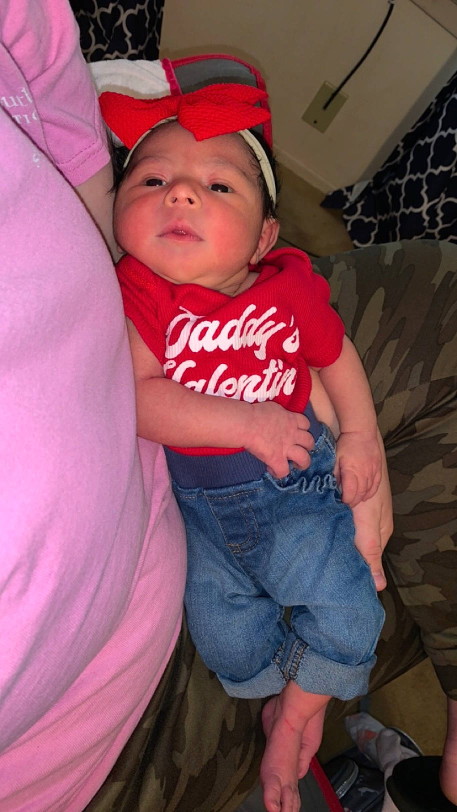 Kaliyah joined the competition — help win amazing prizes! baby, baby_toddler_clothing, cap, cheek, comfort, couch, eye, face, happy, head, headwear, human_leg, jeans, knee, lap, leg, person, pink, t_shirt, thigh