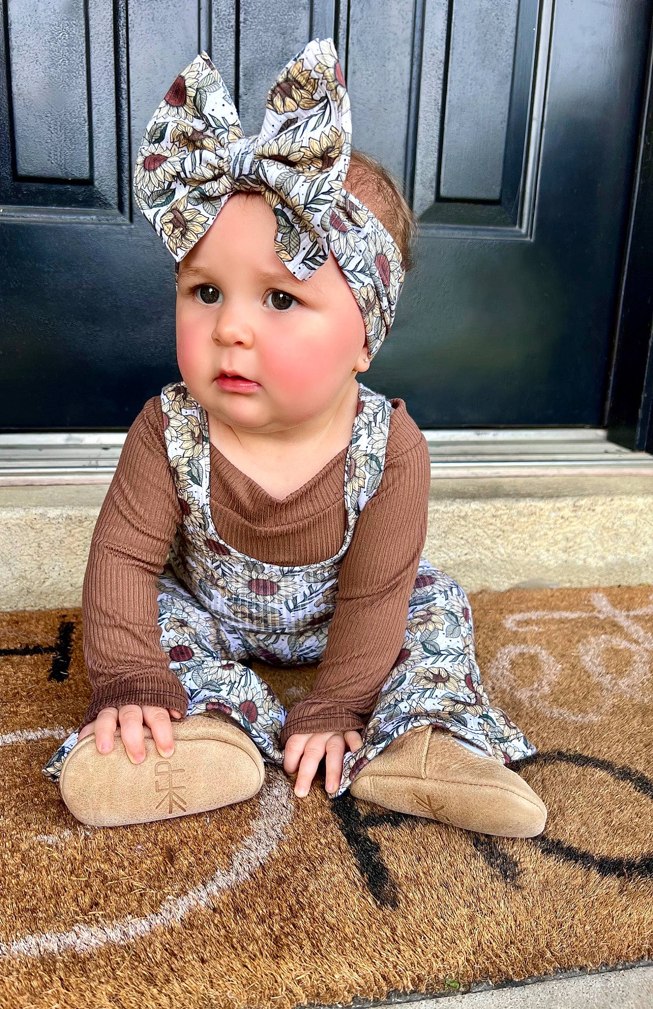 Sylvia is registered to the contest to win money with this photo: baby, baby_toddler_clothing, child, costume, costume_hat, crown, event, fashion_accessory, floor, flooring, fun, grass, hair_accessory, happy, headband, headpiece, headwear, jewellery, person, sitting