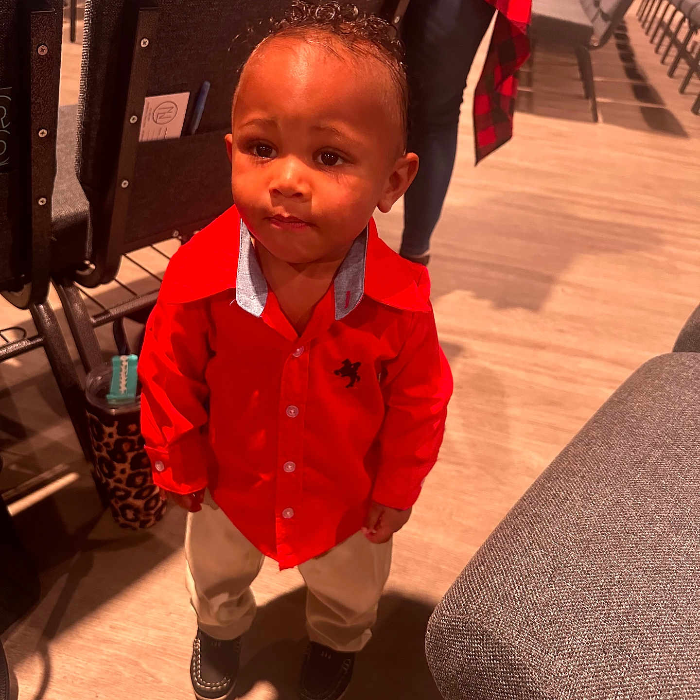 Cason is registered to the contest to win money with this photo: baby, babylaughing, chair, clothing, coat, cornrows, curlyhair, face, footwear, furniture, hair, happy, head, person, shoe, sitting, sleeve, smile, standing, student