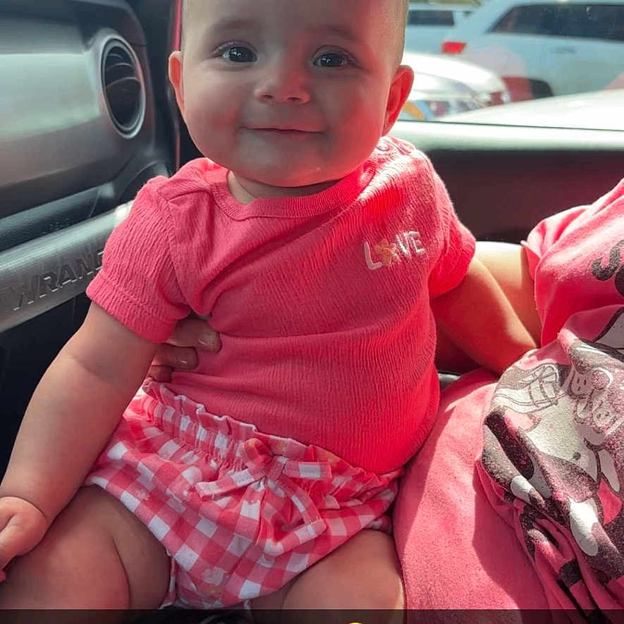 Jazymn is registered to the contest to win money with this photo: accessories, baby, belt, car, clothing, cushion, diaper, face, glove, head, homedecor, person, photography, portrait, sedan, shorts, sitting, t_shirt, transportation, vehicle