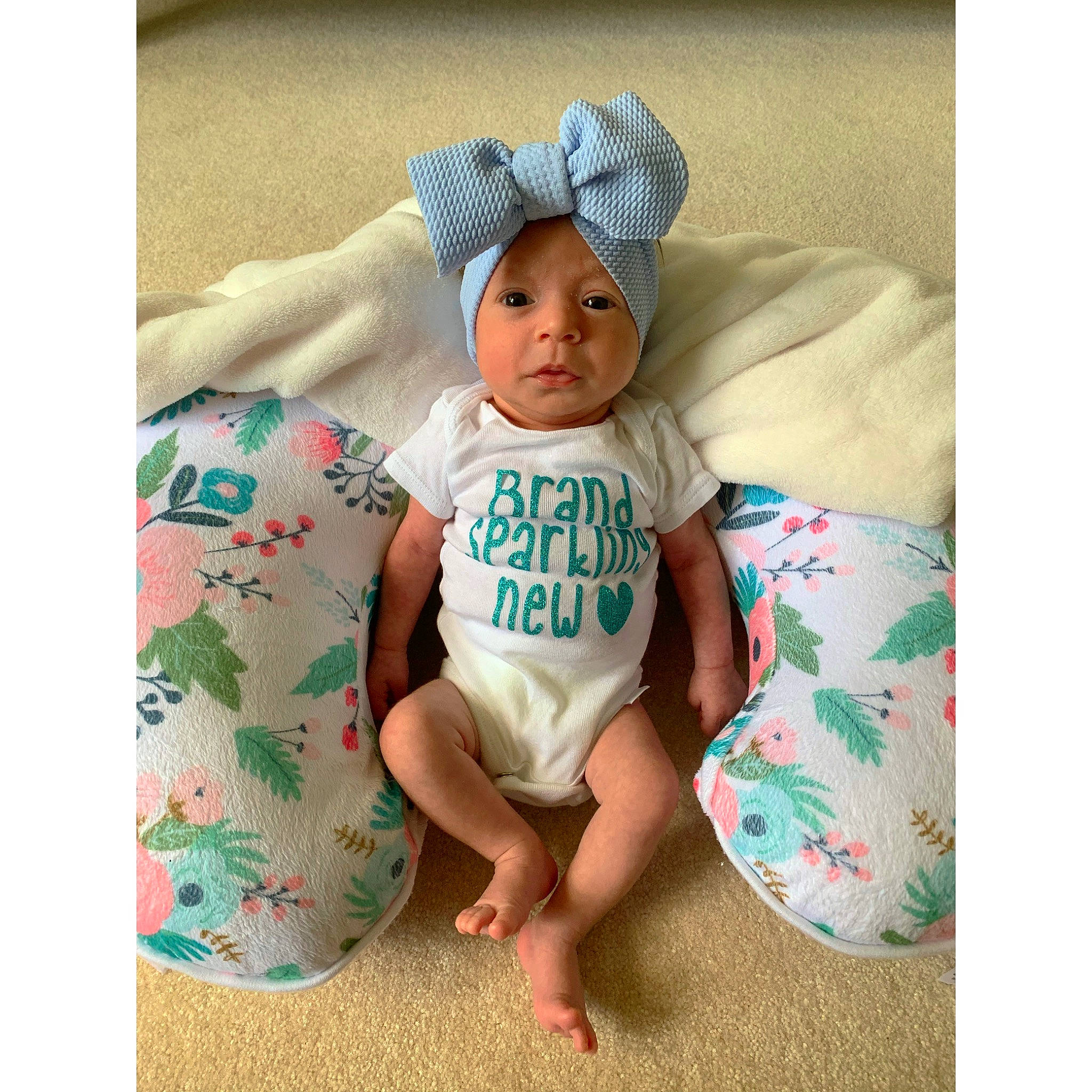 Alia joined the competition — help win amazing prizes! baby, baby_sleeping, baby_toddler_clothing, beige, bonnet, child, headgear, headwear, pattern, person, play, product, sleeve, smile, t_shirt, toddler, turquoise
