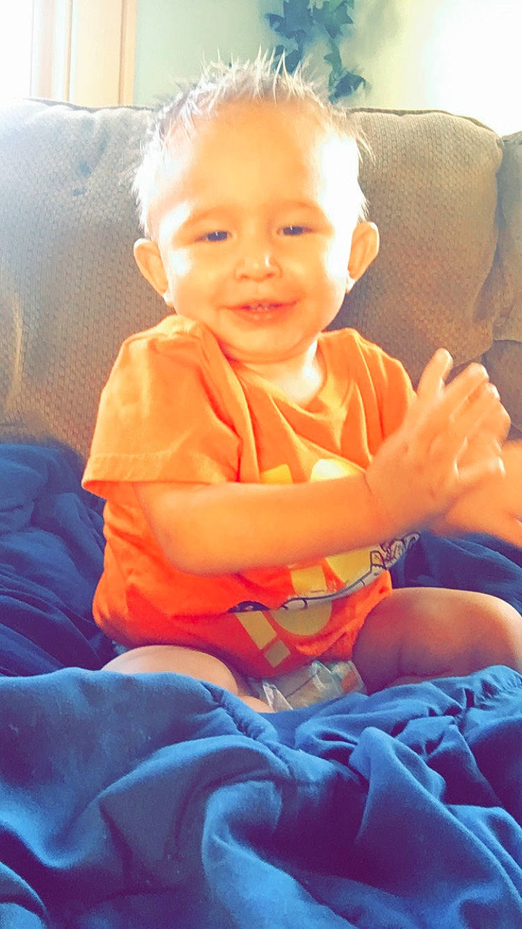 Giovanni joined the competition — help win amazing prizes! baby, cheek, child, face, fun, happy, joy, orange, person, play, sitting, smile, toddler