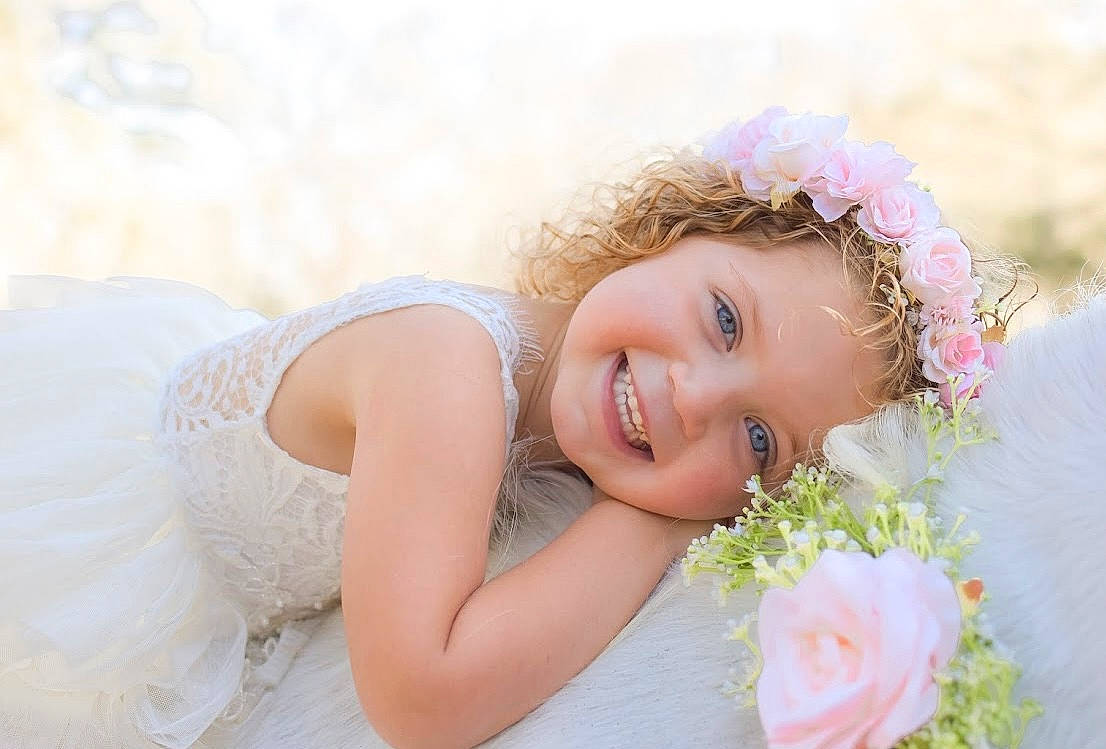 Oaklynn joined the competition — help win amazing prizes! bridal_accessory, bridal_clothing, dress, face, flash_photography, flower, gesture, hand, happy, head, headpiece, iris, joy, people_in_nature, person, petal, pink, plant, skin, smile