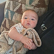 Pj joined the competition — help win amazing prizes! baby, blanket, person, pillow, indoor, cozy, infant, clothing, fabric, face, hand, comfort, child, couch, resting, soft, casual, portrait, home, relaxation