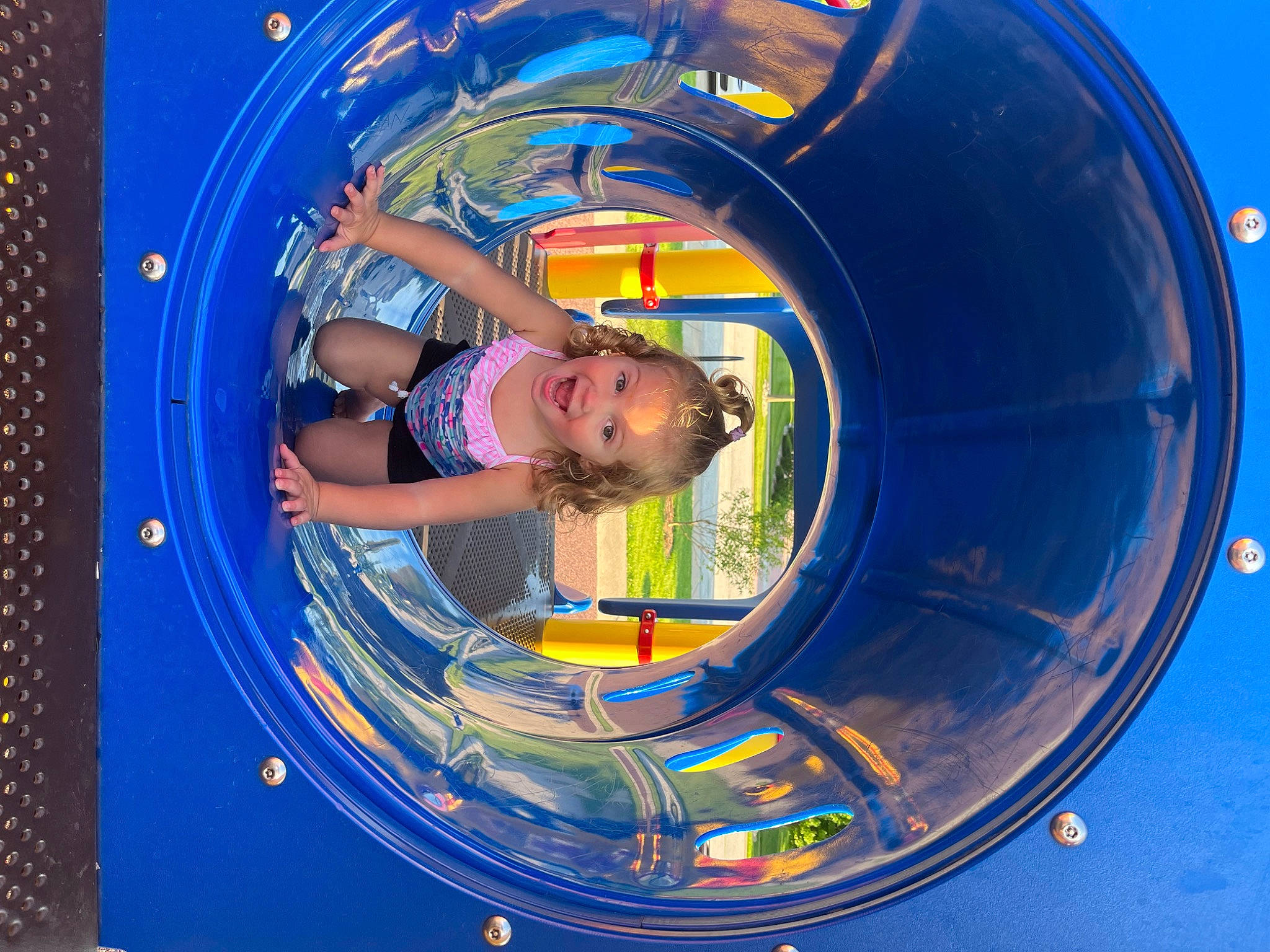 Adalyn is registered to the contest to win money with this photo: amusement_park, auto_part, child, chute, circle, electric_blue, engineering, fun, games, leisure, machine, person, play, playground, recreation, surprise