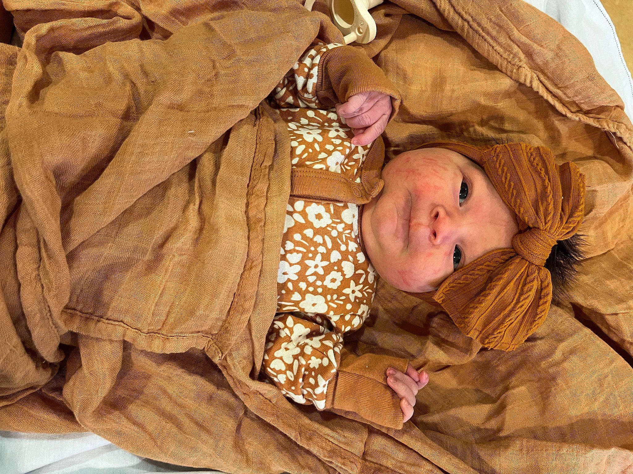 Sadie joined the competition — help win amazing prizes! baby, baby_toddler_clothing, bedtime, beige, brown, cheek, child, comfort, face, flooring, headwear, linens, pattern, peach, person, room, skin, sleeve, textile, toddler