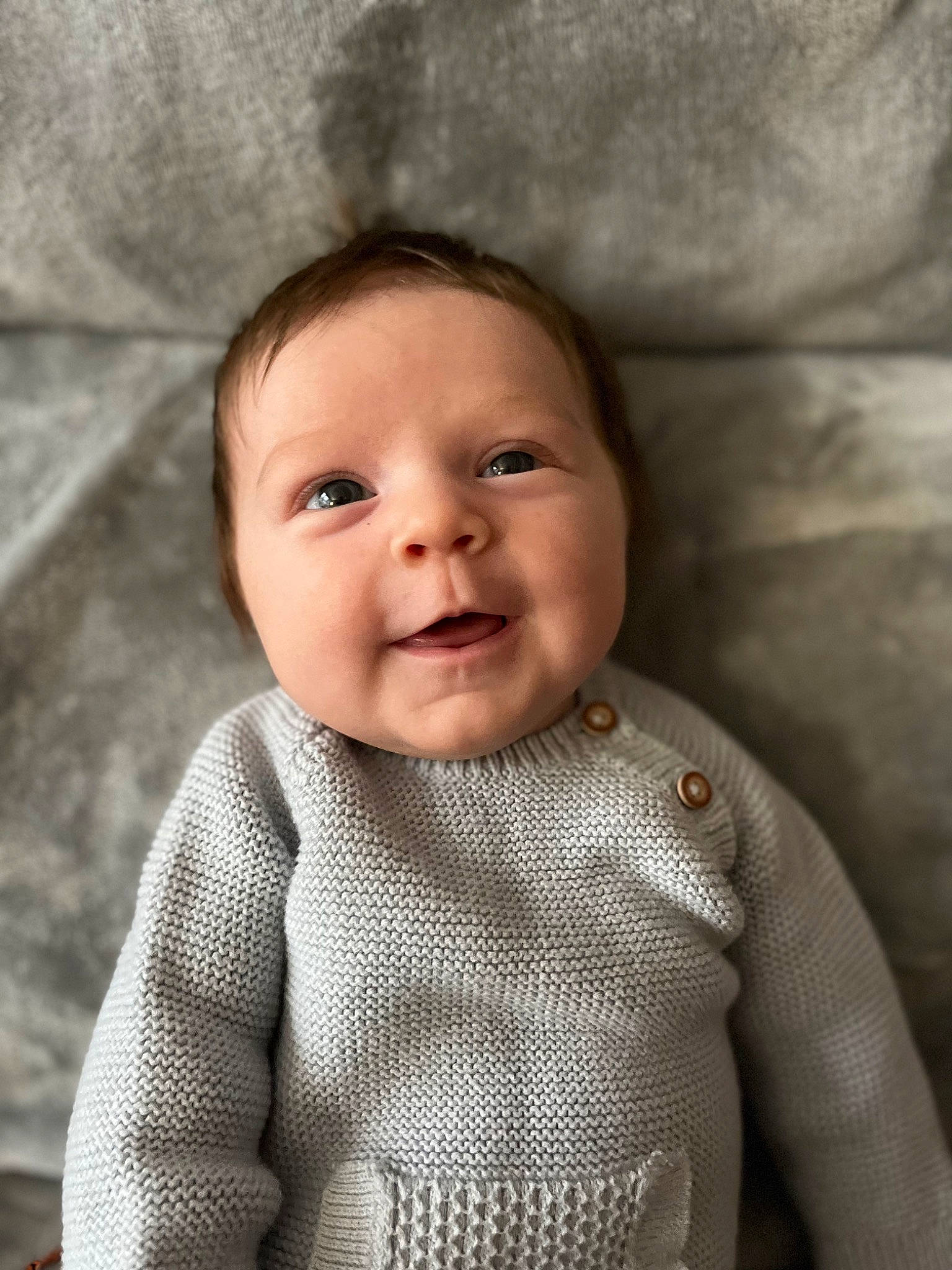 Sadie is registered to the contest to win money with this photo: baby, baby_toddler_clothing, cheek, chin, clothing, eyebrow, face, flash_photography, grey, happy, head, iris, lip, neck, person, skin, sleeve, smile, textile, toddler