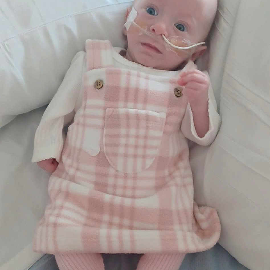 Willow-Mae is registered to the contest to win money with this photo: baby, bed, bedroom, blanket, clothing, couch, cushion, face, furniture, head, homedecor, indoors, linen, newborn, pants, person, photography, pillow, portrait, toy