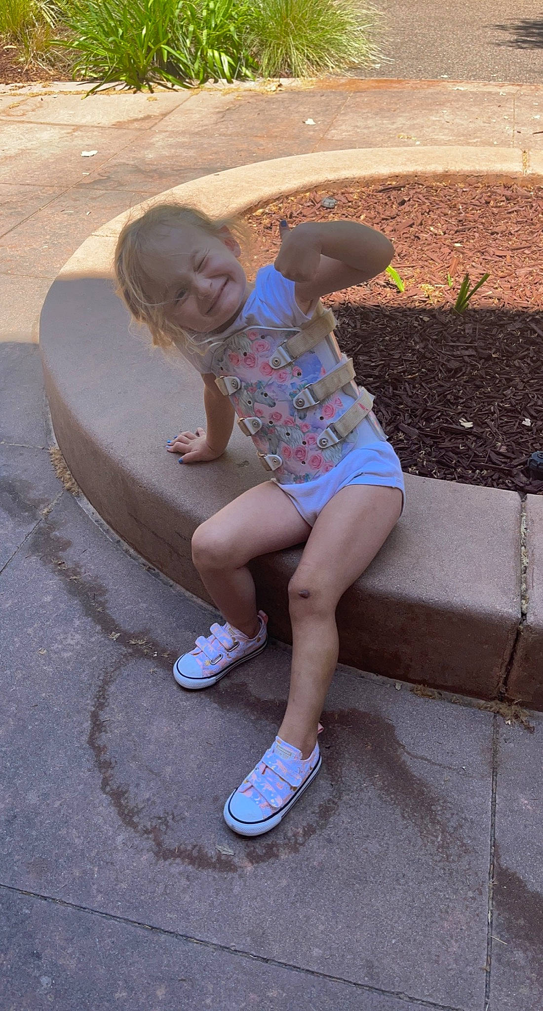 Harper joined the competition — help win amazing prizes! asphalt, cool, footwear, grass, hair, head, human_leg, joy, leg, leisure, mouth, person, recreation, road_surface, shorts, sidewalk, smile, t_shirt, thigh, toddler