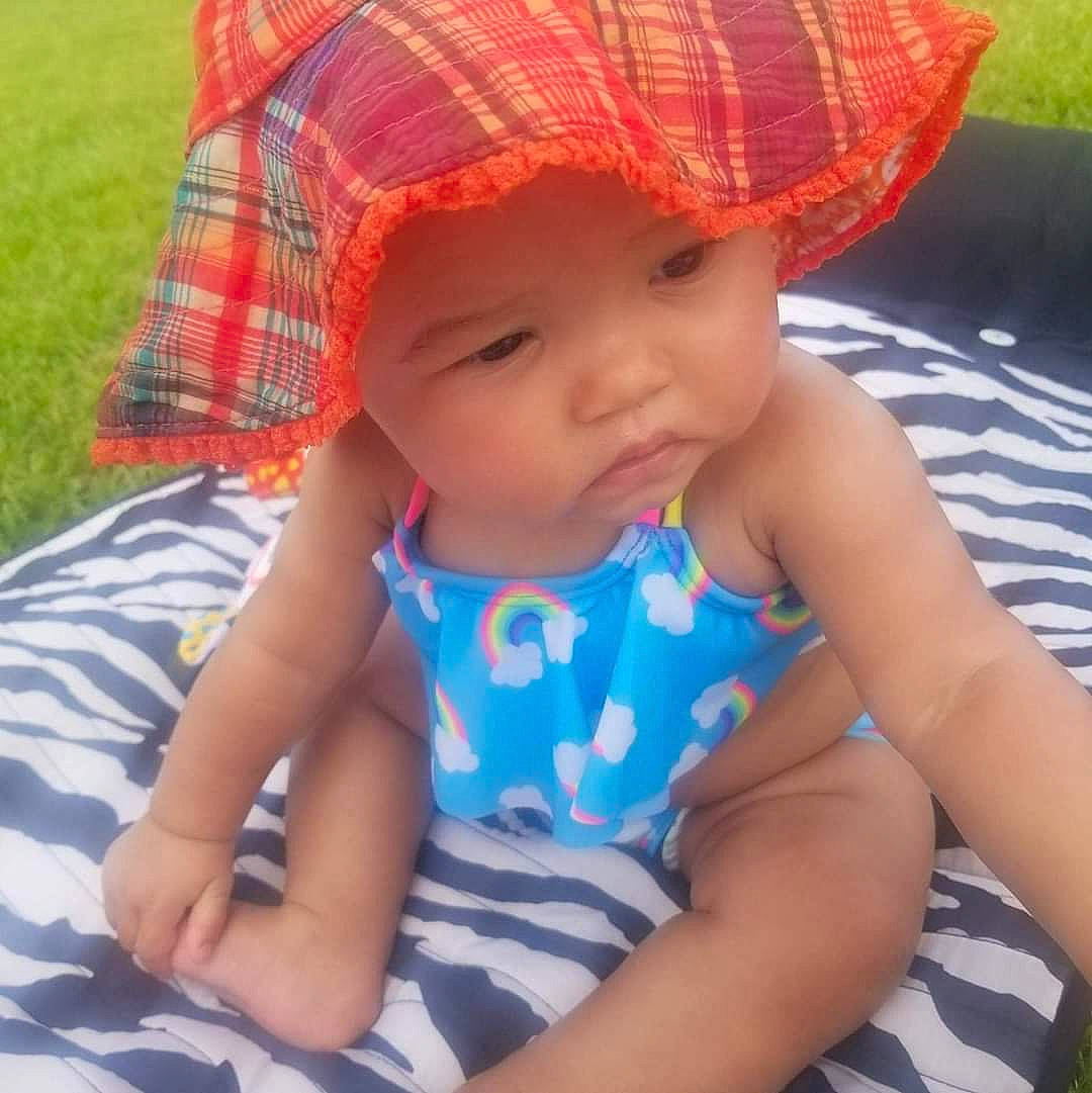 Jazmyn joined the competition — help win amazing prizes! baby, baby_products, baby_toddler_clothing, child, fashion_accessory, hat, headgear, headwear, pattern, person, product, summer, sun_hat, toddler