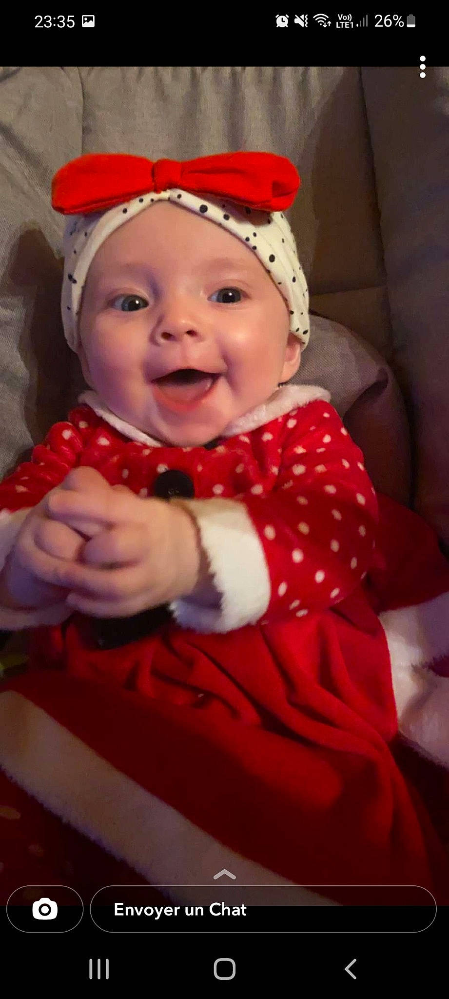 Atilya participe au concours pour gagner de l'argent avec cette photo : baby, baby_laughing, baby_toddler_clothing, child, costume_hat, eye, face, fun, happy, head, headgear, headwear, human_body, lip, person, pink, red, santa_claus, skin, sleeve