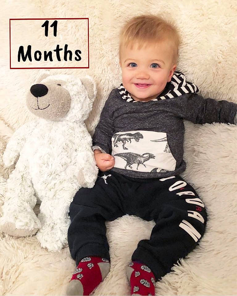 Preston is registered to the contest to win money with this photo: baby, baby_products, baby_toddler_clothing, child, fur, joy, male, outerwear, person, product, sleeve, smile, stuffed_toy, teddy_bear, toddler