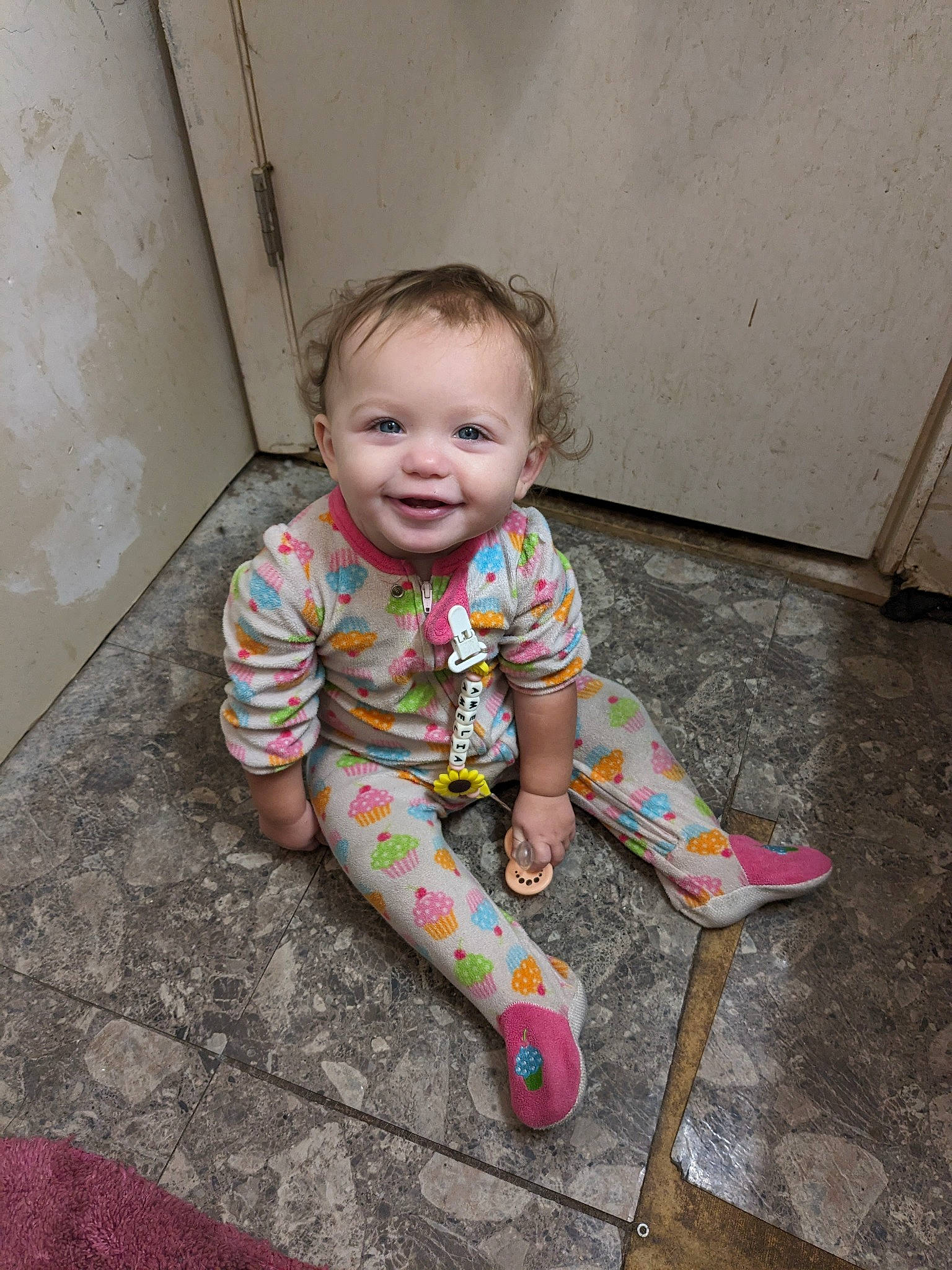 Amelia joined the competition — help win amazing prizes! baby, baby_toddler_clothing, cheek, child, dress, eye, face, floor, flooring, fun, hair, happy, hardwood, human_body, joy, person, pink, road_surface, skin, smile