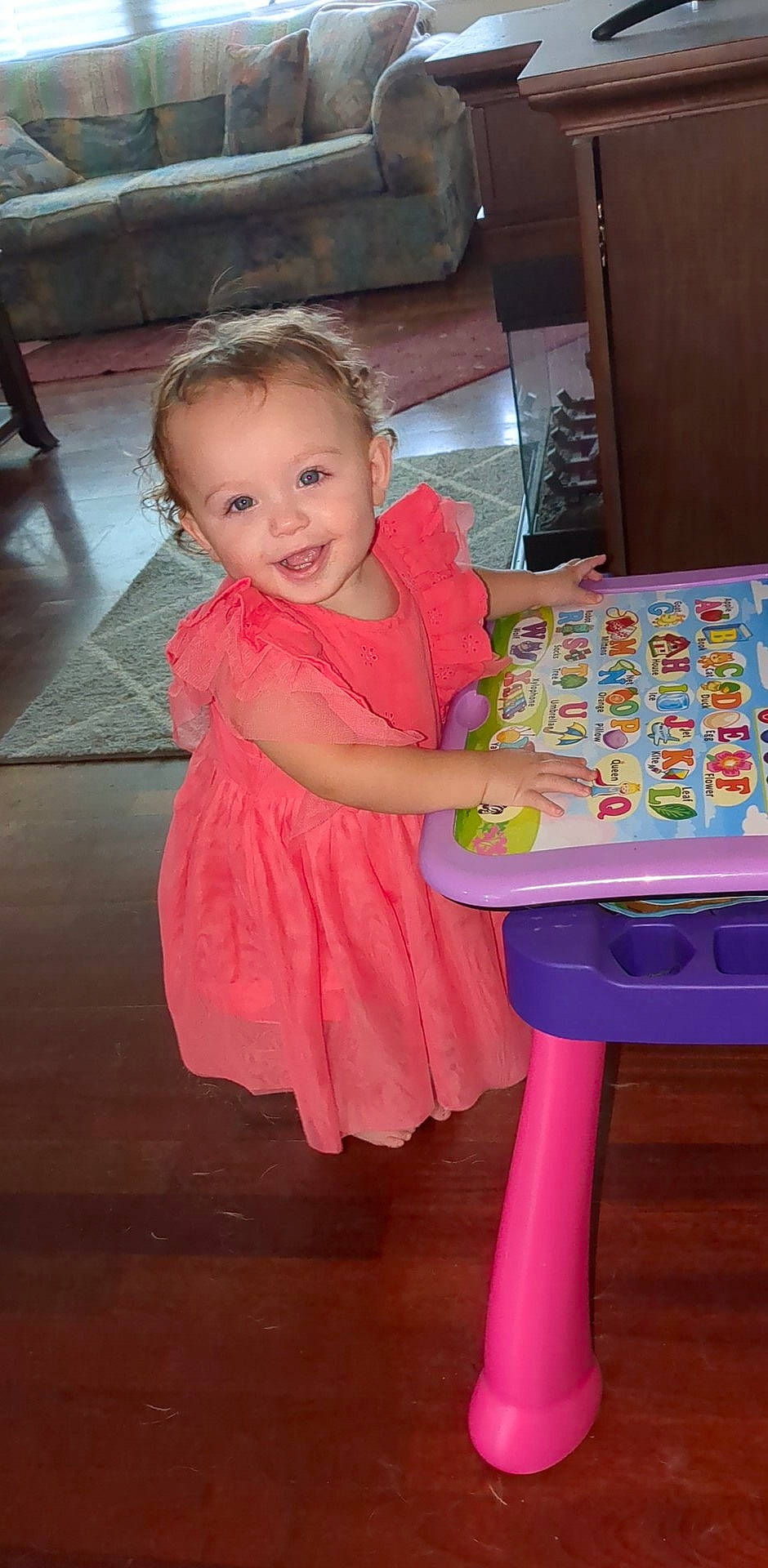 Amelia joined the competition — help win amazing prizes! baby_toddler_clothing, beauty, chair, child, dress, event, flooring, fun, happy, hardwood, joy, magenta, person, pink, product, purple, sitting, smile, standing, textile