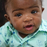 Zaccai joined the competition — help win amazing prizes! baby, infant, face, portrait, child, cute, curious, eyes, skin, clothing, shirt, pattern, blue, green, closeup, expression, young, head, person, indoor
