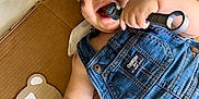 Lucas is registered to the contest to win money with this photo: baby, bandana, cardboard, child, cute, denim_overalls, face_paint, hand, happy, indoors, infant, laying_down, metallic, one_month, overalls, playful, portrait, smiling, tools, wrench