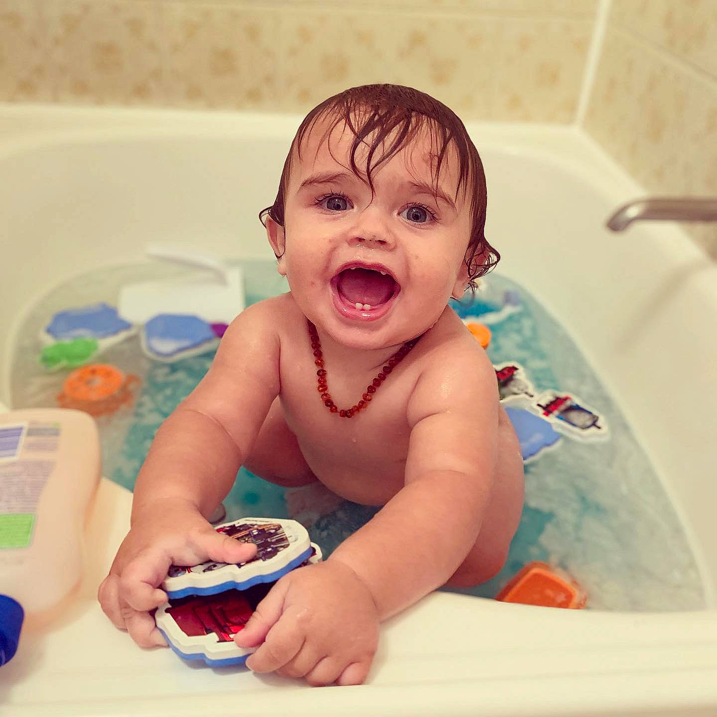 Tremaine is registered to the contest to win money with this photo: baby, baby_bathing, baby_laughing, baby_making_funny_faces, bathing, bathtub, child, facial_expression, fun, happy, nose, person, play, plumbing_fixture, skin, smile, toddler