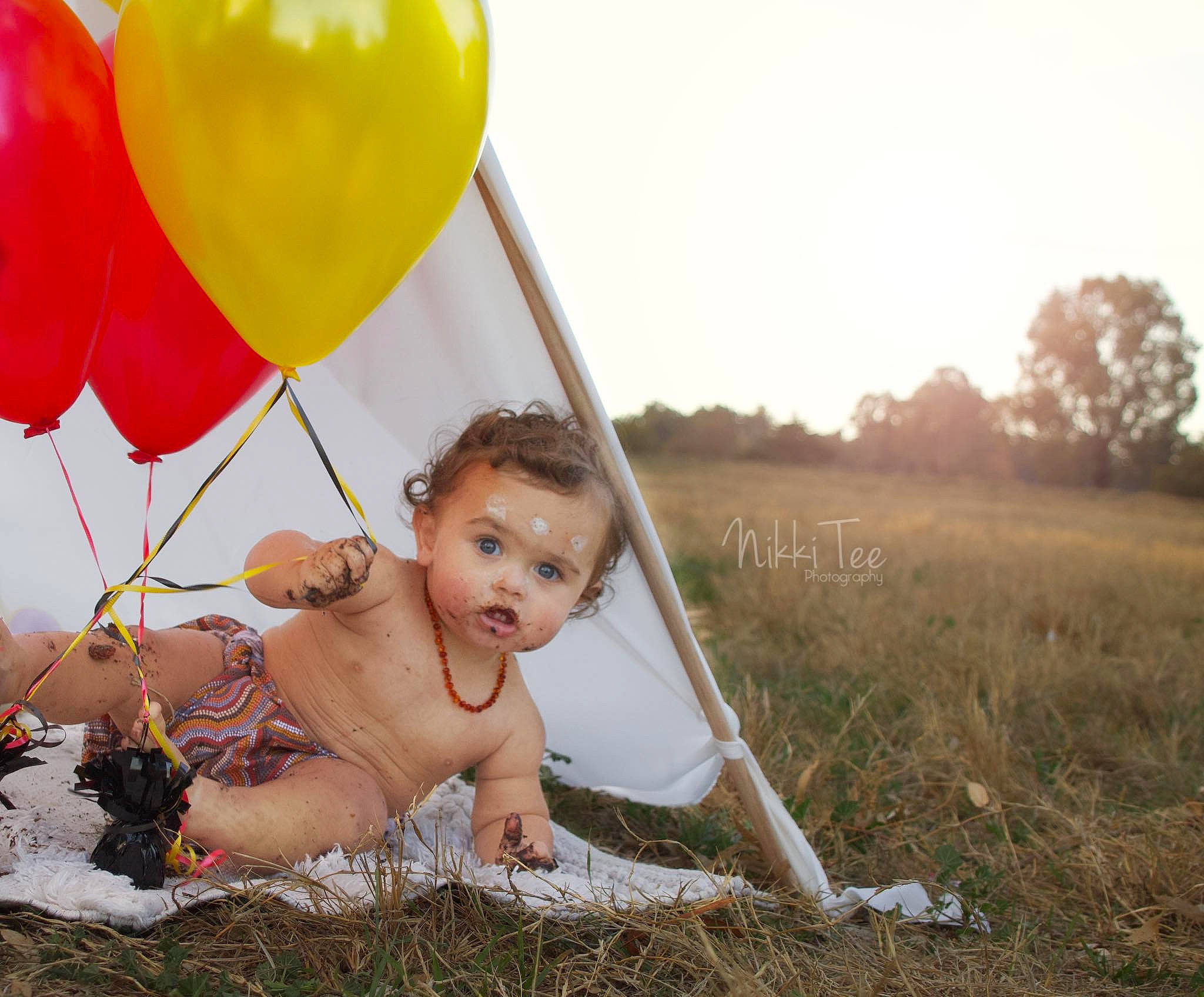 Tremaine joined the competition — help win amazing prizes! baby, balloon, child, fun, grass, grassland, happy, leisure, meadow, party_supply, person, photography, play, recreation, smile, stock_photography, summer, toddler, toy, yellow