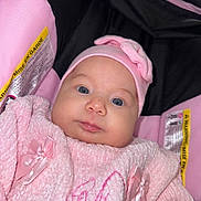 Helen joined the competition — help win amazing prizes! baby, infant, child, pink, hat, bow, car_seat, clothing, cute, face, blue_eyes, soft_texture, warm, newborn, portrait, closeup, indoors, safety_label, happy, cozy