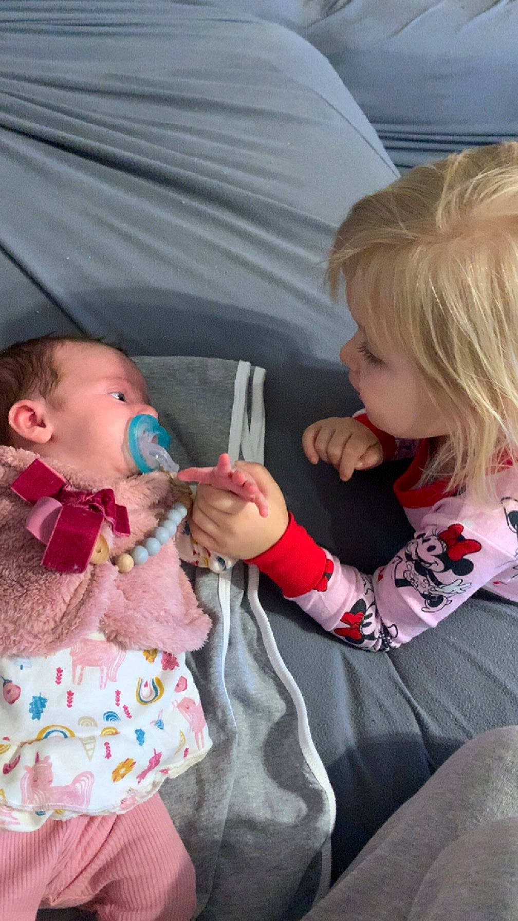 Amberlyn is registered to the contest to win money with this photo: baby, baby_toddler_clothing, chair, cheek, child, comfort, couch, event, finger, fun, gesture, hairstyle, happy, lap, mouth, person, pink, sharing, sitting, skin