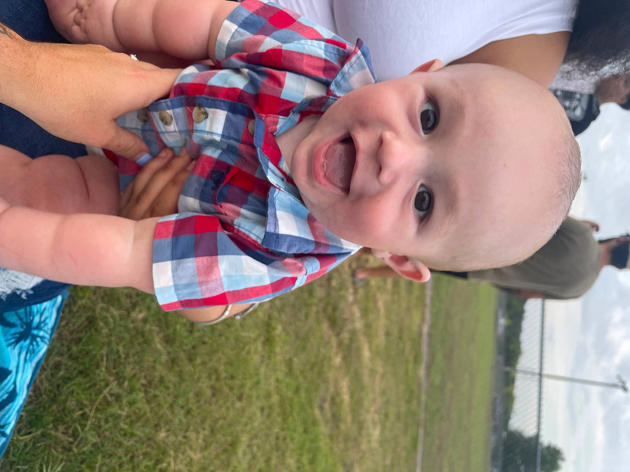 Reece joined the competition — help win amazing prizes! arm, baby, child, cloud, finger, fun, gesture, grass, hand, happy, joy, lip, nose, organ, people, person, plaid, plant, skin, smile