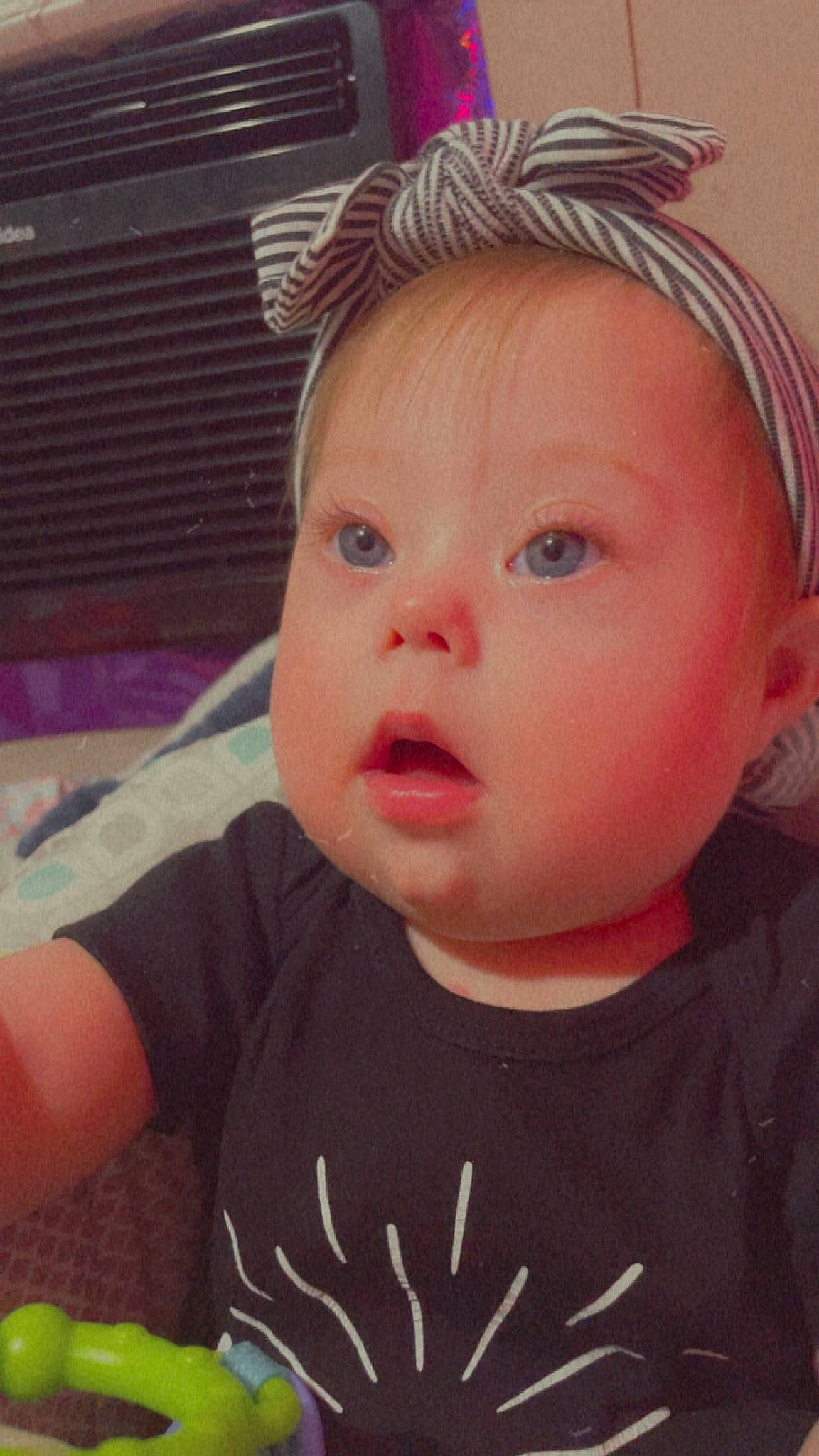 Freya is registered to the contest to win money with this photo: baby, baby_toddler_clothing, cheek, clothing, ear, eye, eyebrow, eyelash, forehead, happy, headgear, helmet, iris, lip, nose, person, pink, skin, sleeve, surprise