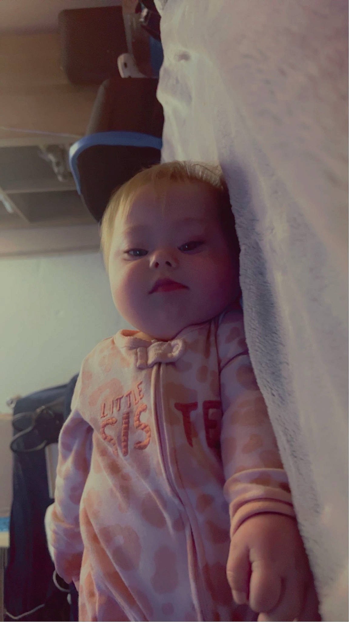 Freya is registered to the contest to win money with this photo: baby, baby_products, baby_toddler_clothing, cheek, child, comfort, eyebrow, eyelash, fashion_accessory, happy, hat, iris, linens, lip, neck, peach, person, sitting, sleeve, thumb