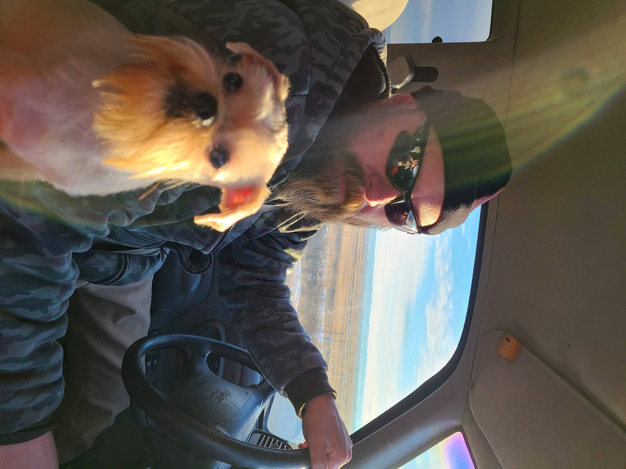 Titi is registered to the contest to win money with this photo: auto_part, automotive_design, automotive_exterior, automotive_lighting, automotive_window_part, eyewear, family_car, fun, fur, gesture, goggles, hat, luxury_vehicle, mouth, sky, sunglasses, vehicle_door, vision_care, whiskers, windshield