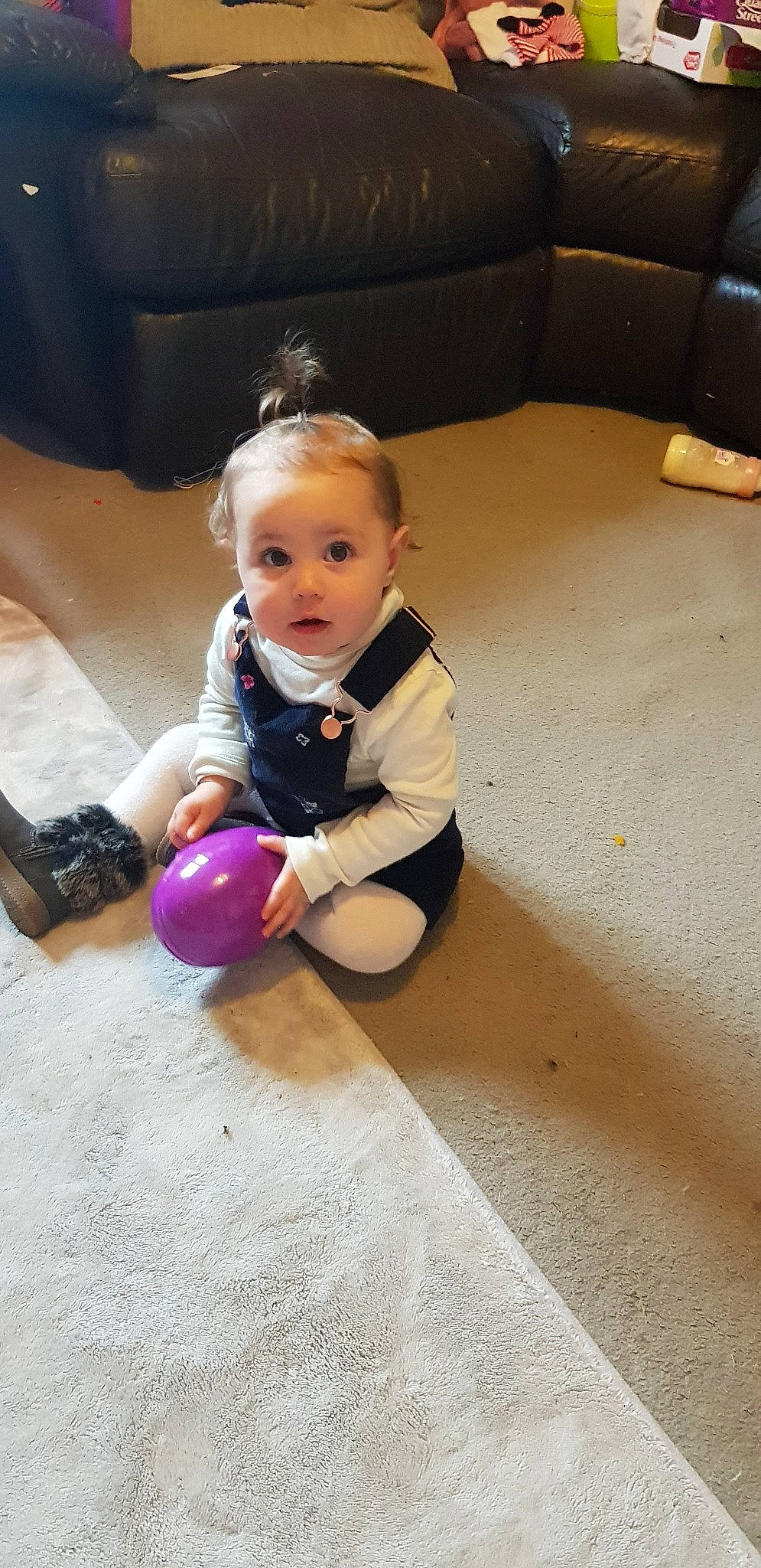 Delilah-rose is registered to the contest to win money with this photo: ball, child, floor, flooring, leg, person, play, sitting, surprise, toddler
