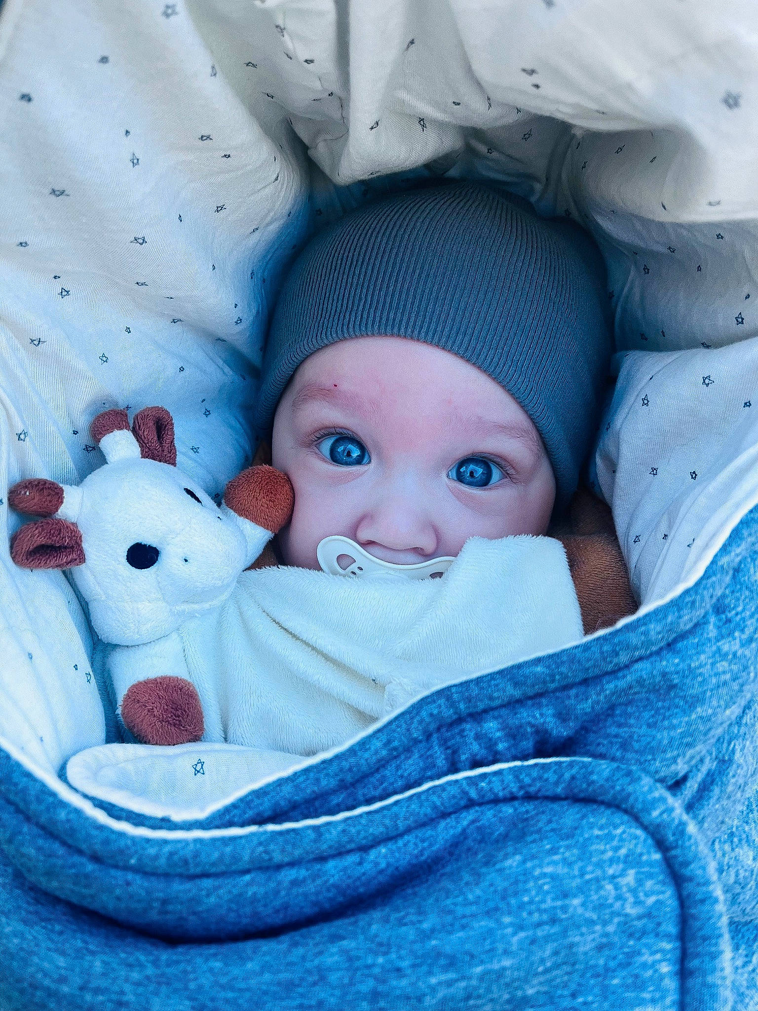 Lucas participe au concours pour gagner de l'argent avec cette photo : azure, baby, baby_products, baby_sleeping, baby_toddler_clothing, beauty, cap, cheek, child, comfort, electric_blue, face, headgear, headwear, knit_cap, linens, person, product, textile, toddler