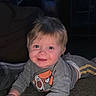 Waylon is registered to the contest to win money with this photo: baby, child, smiling, indoor, carpet, grey_clothing, long_sleeves, toy, happy, face, blond_hair, crawling, toddler, cute, playful, portrait, young_child, infant, human, home