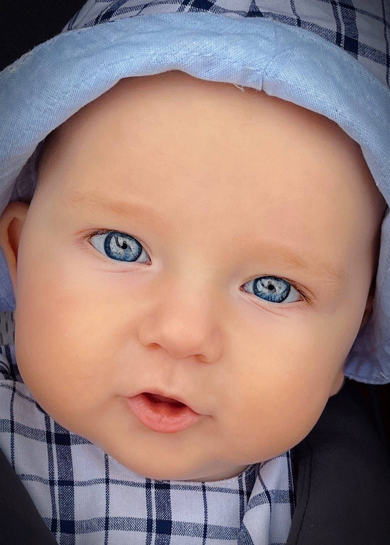 Oslo joined the competition — help win amazing prizes! baby, cap, cheek, chin, clothing, eye, eyebrow, eyelash, flash_photography, hat, headgear, headwear, iris, lip, nose, outerwear, person, skin, tartan, textile