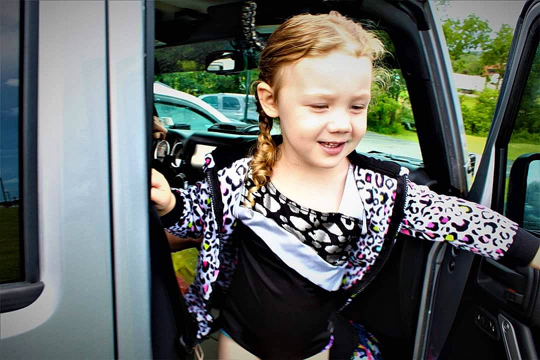 Karly is registered to the contest to win money with this photo: auto_part, car, car_seat, child, city_car, family_car, fun, joy, long_hair, motor_vehicle, passenger, person, public_transport, smile, street_fashion, toddler, transport, travel, tree, vacation