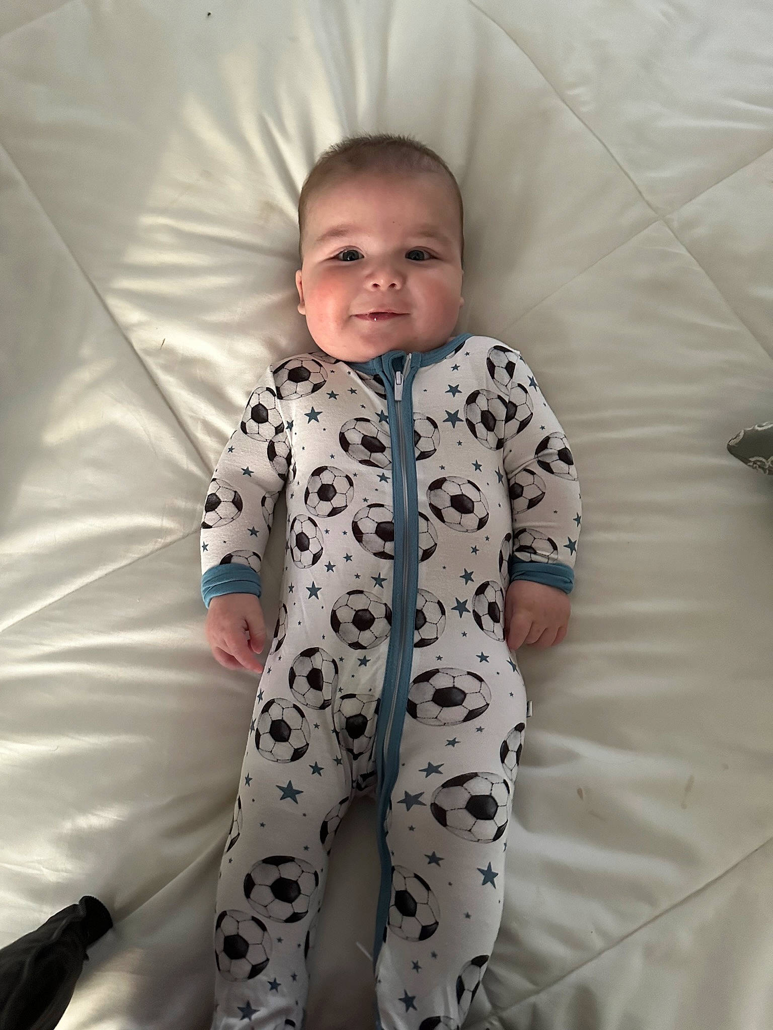 Haiden is registered to the contest to win money with this photo: baby, baby_toddler_clothing, child, comfort, fun, happy, joy, linens, pattern, person, portrait_photography, sitting, sleeve, smile, sweatpant, toddler