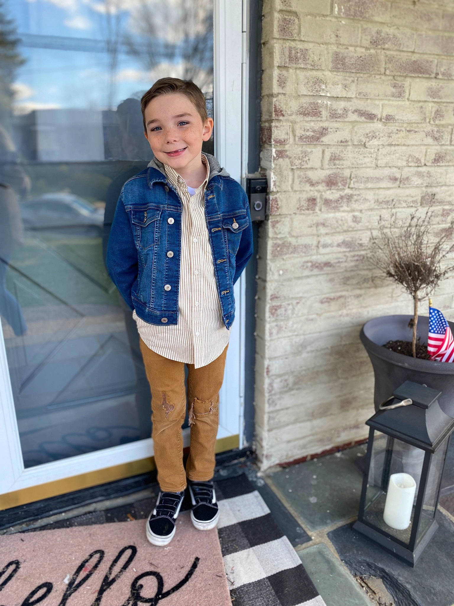 Caleb is registered to the contest to win money with this photo: boot, child, denim, electric_blue, fashion_design, flooring, formal_wear, fur, human_leg, jacket, joy, knee, outerwear, pattern, person, scarf, sleeve, smile, standing, style