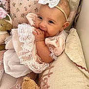 Hattie-Bloom joined the competition — help win amazing prizes! baby, child, infant, girl, smiling, lace, headband, bow, pillow, teddy_bear, soft_toy, pink_clothing, white_clothing, sitting, cute, indoors, happy, portrait, cozy, hands